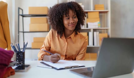 Small Business Owner Working on Laptop
